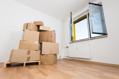 Packed office boxes and labelled items for commercial relocation