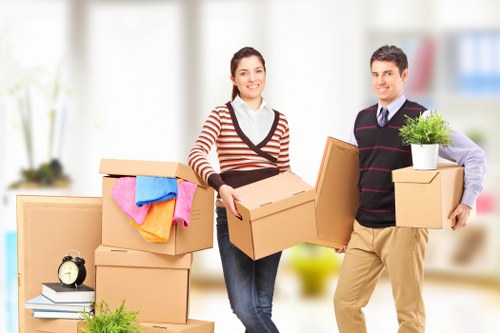 Packed office equipment and furniture ready for local relocation
