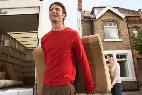 Driver and movers following safe unloading procedures