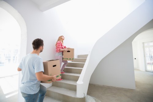 Professional movers handling furniture during a local move in West Hampstead