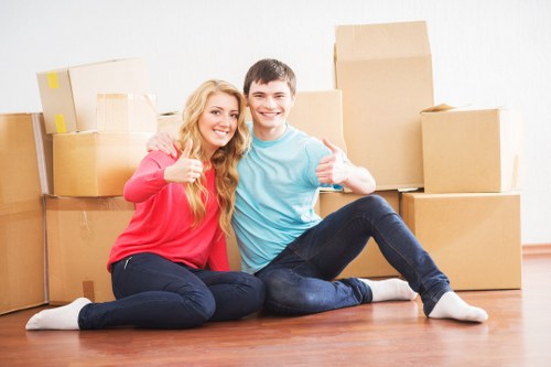 Moving furniture through a West Hampstead flat with stair access